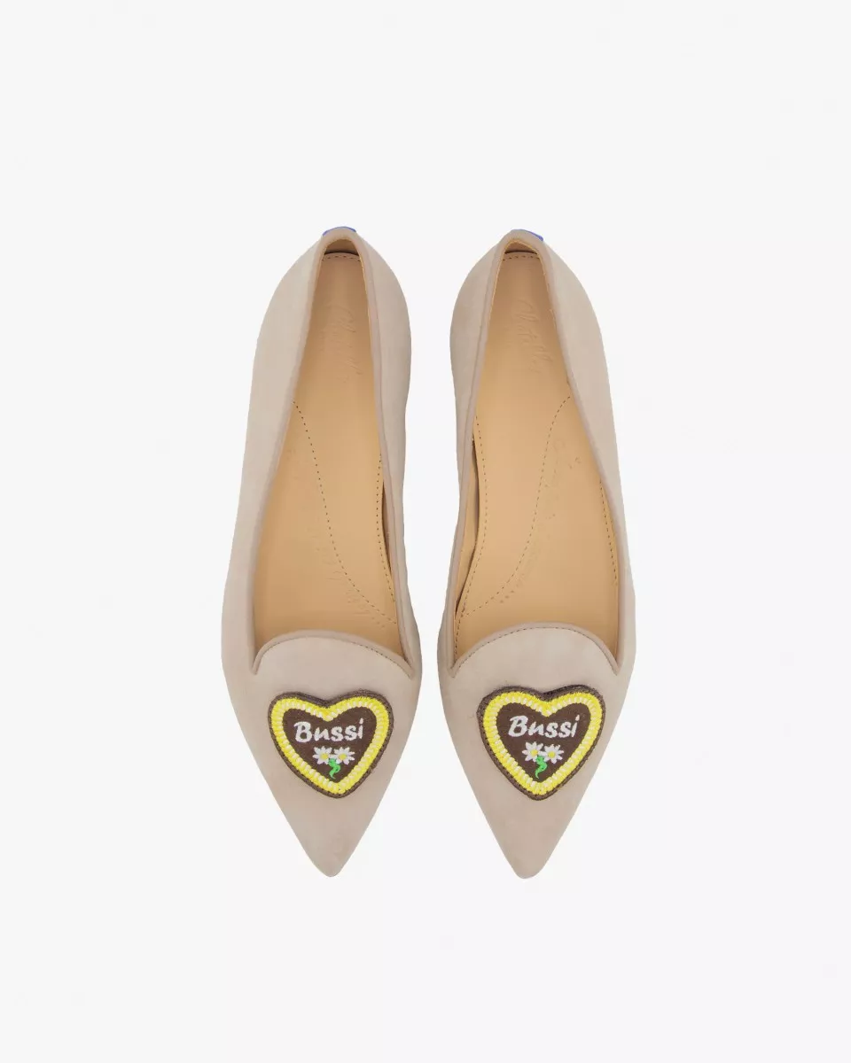 Camel suede pointy slippers with a heart patch reading "Bussi" (kiss in German)