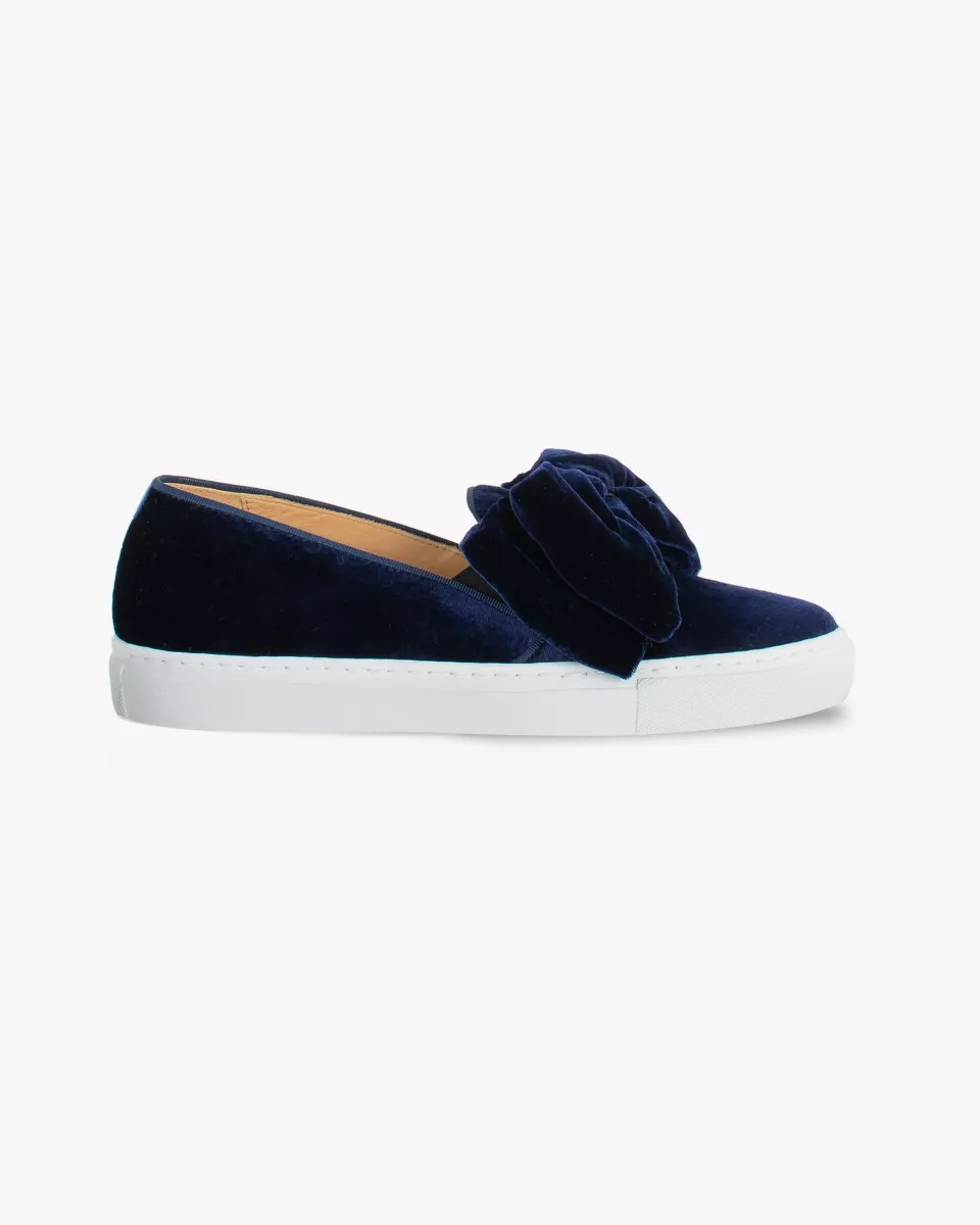 Navy blue velvet slip-ons with oversized bow