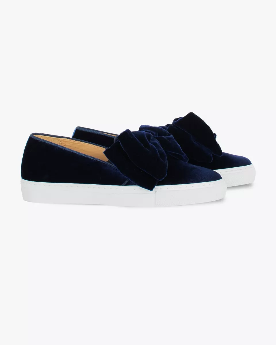 Navy blue velvet slip-ons with oversized bow